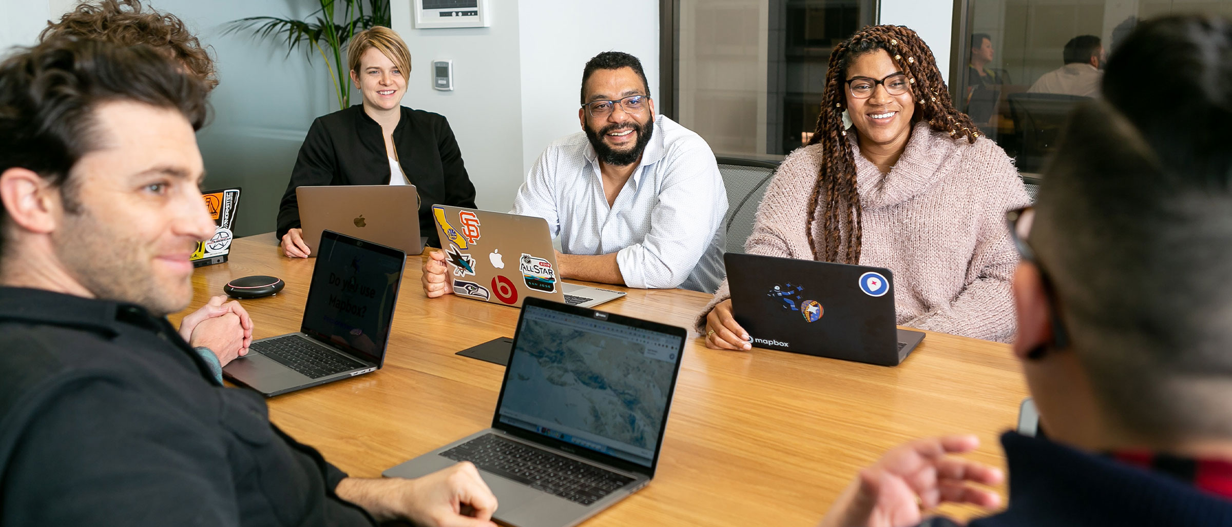 Co-Workers sitting around conference room table