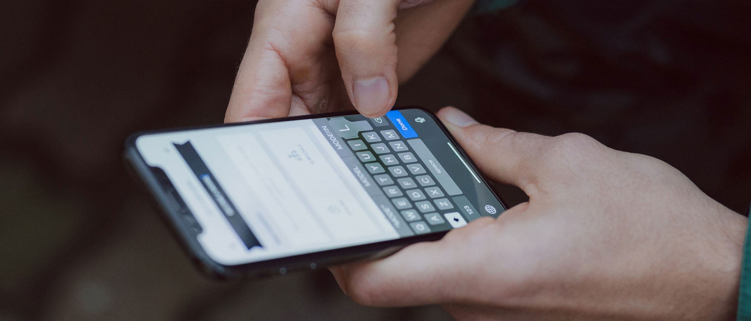 Person typing on smartphone