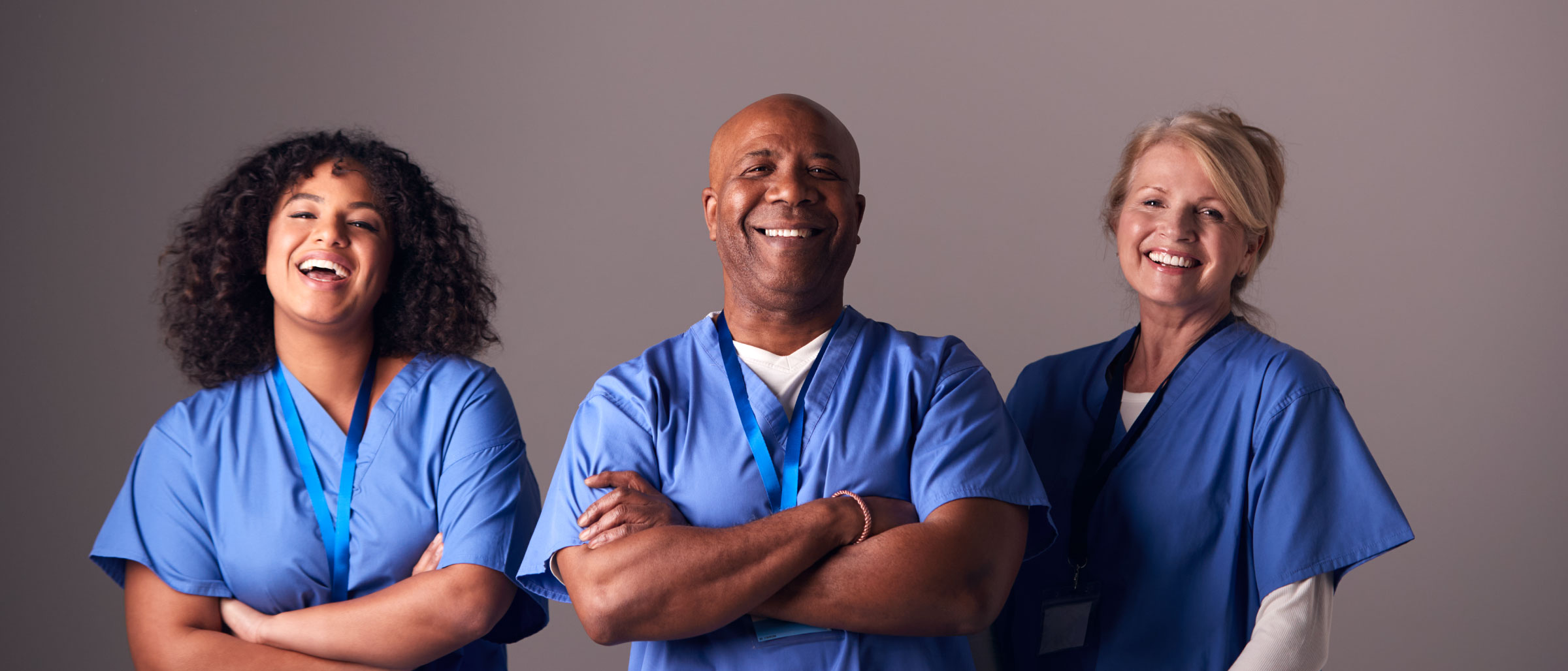 Nurses smiling in scrubs