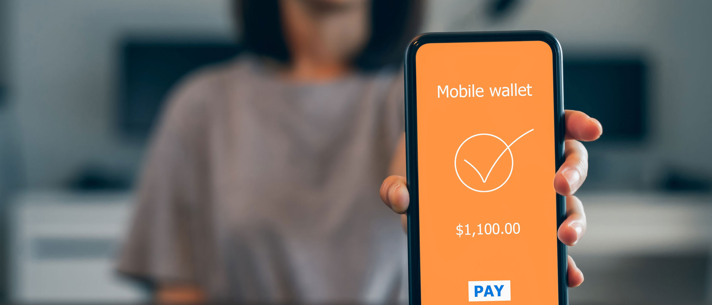 Mobile Wallet with $1,100 transfer on screen