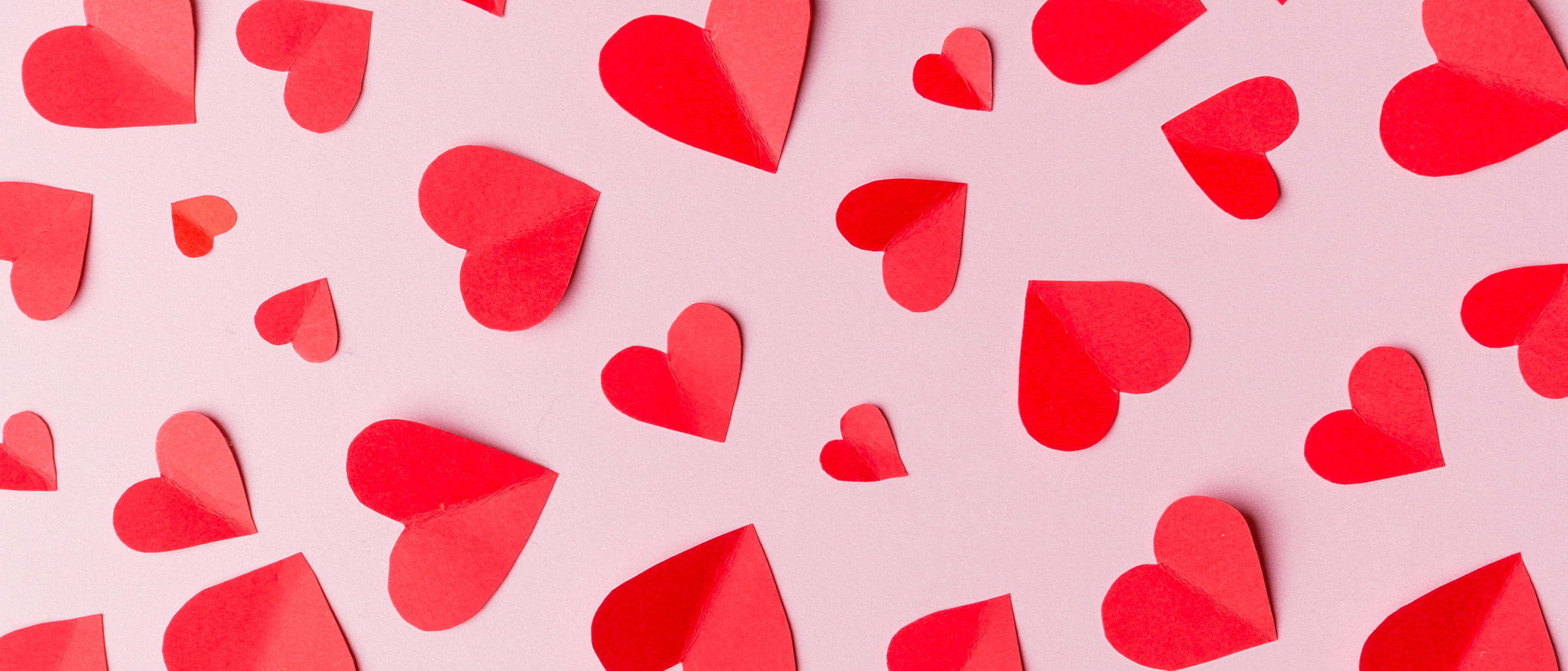 Red Hearts on Pink Background