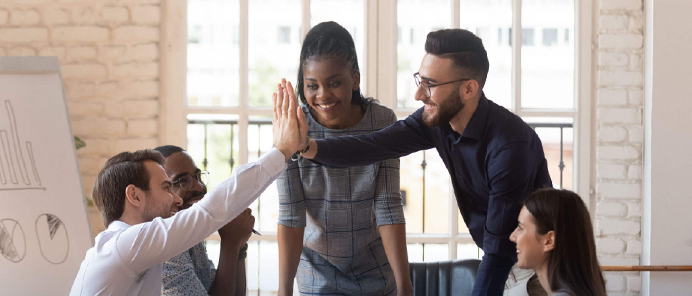 Work team excited in meeting