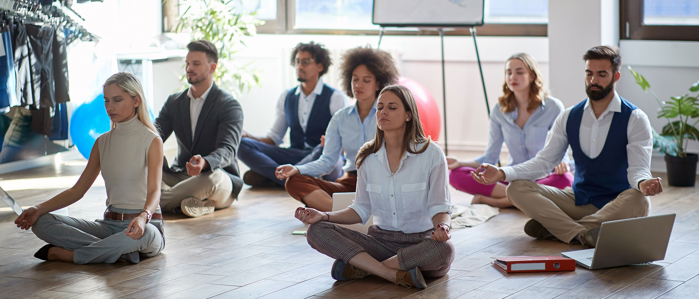 Room full of people meditating