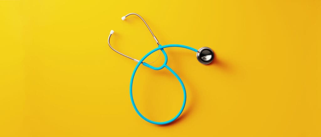 Stethoscope on yellow background