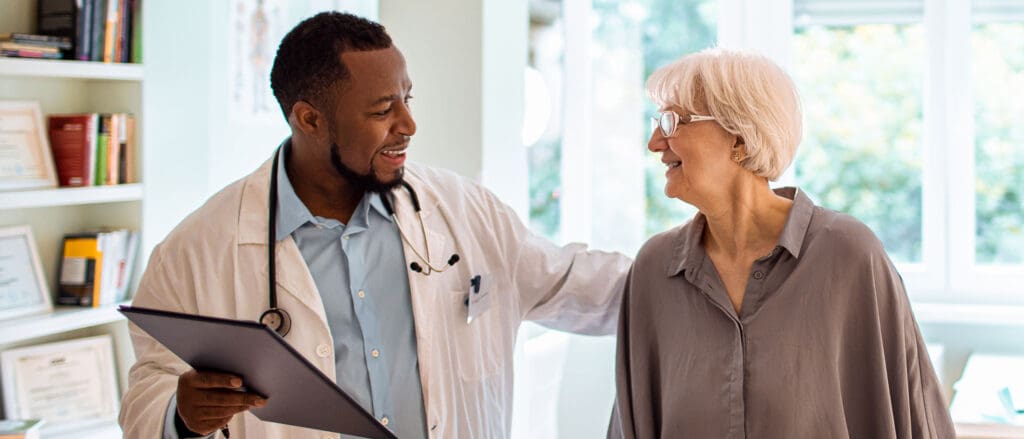 Medical Professional helping older woman