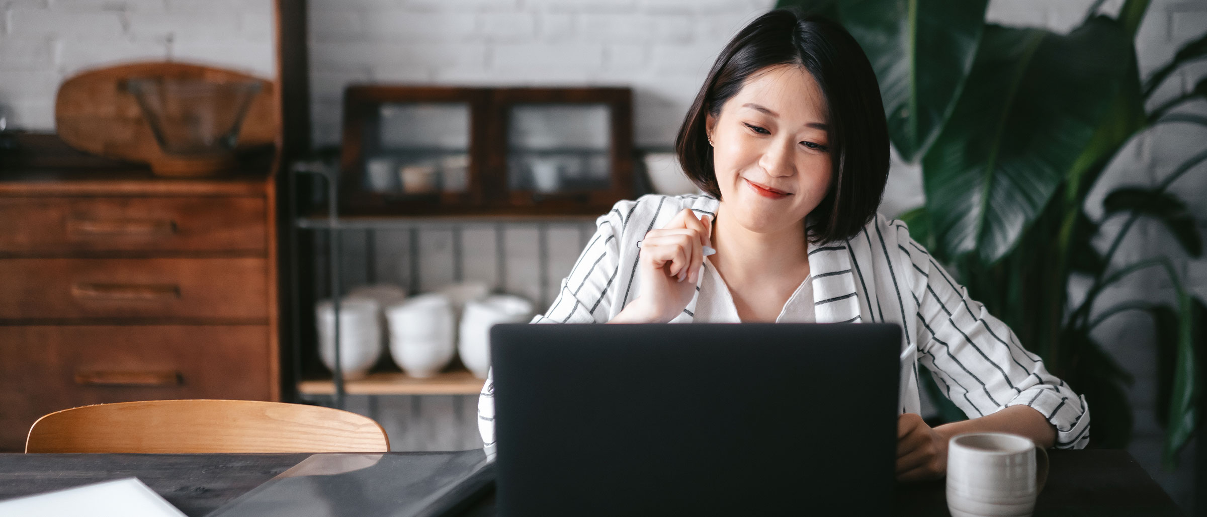 Woman typing on laptop