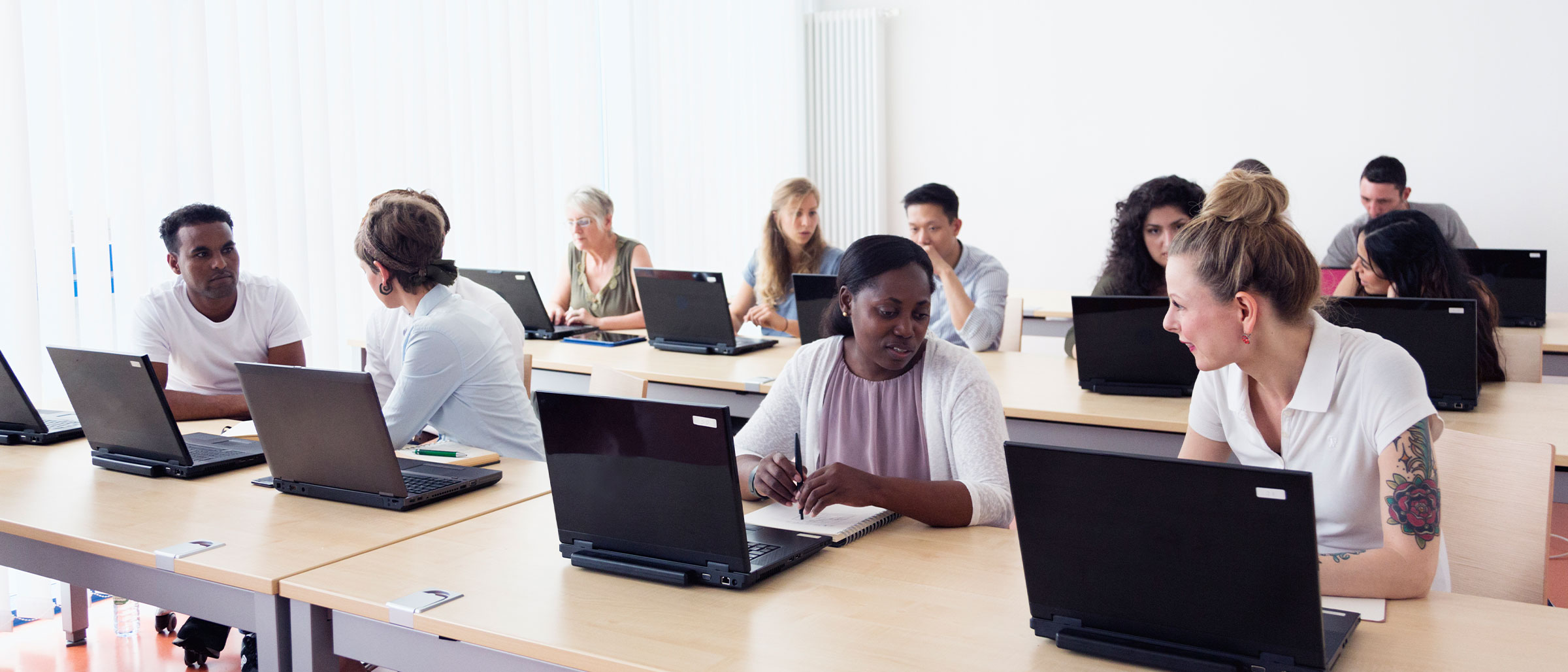 Room full of employees on laptops