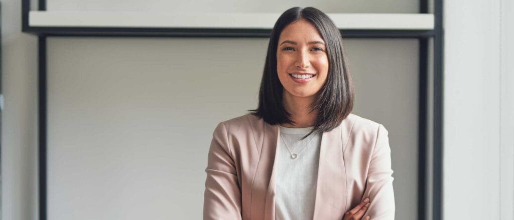 Woman smiling with arms crossed