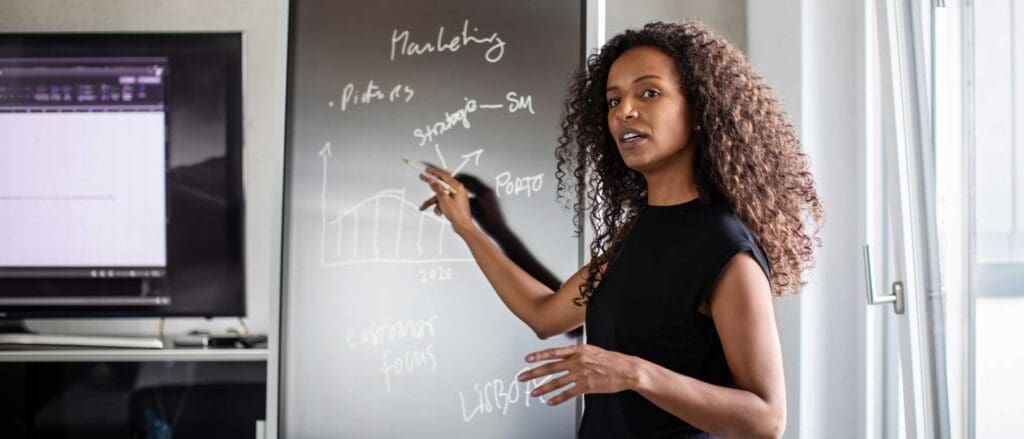 Woman pointing at presentation on board