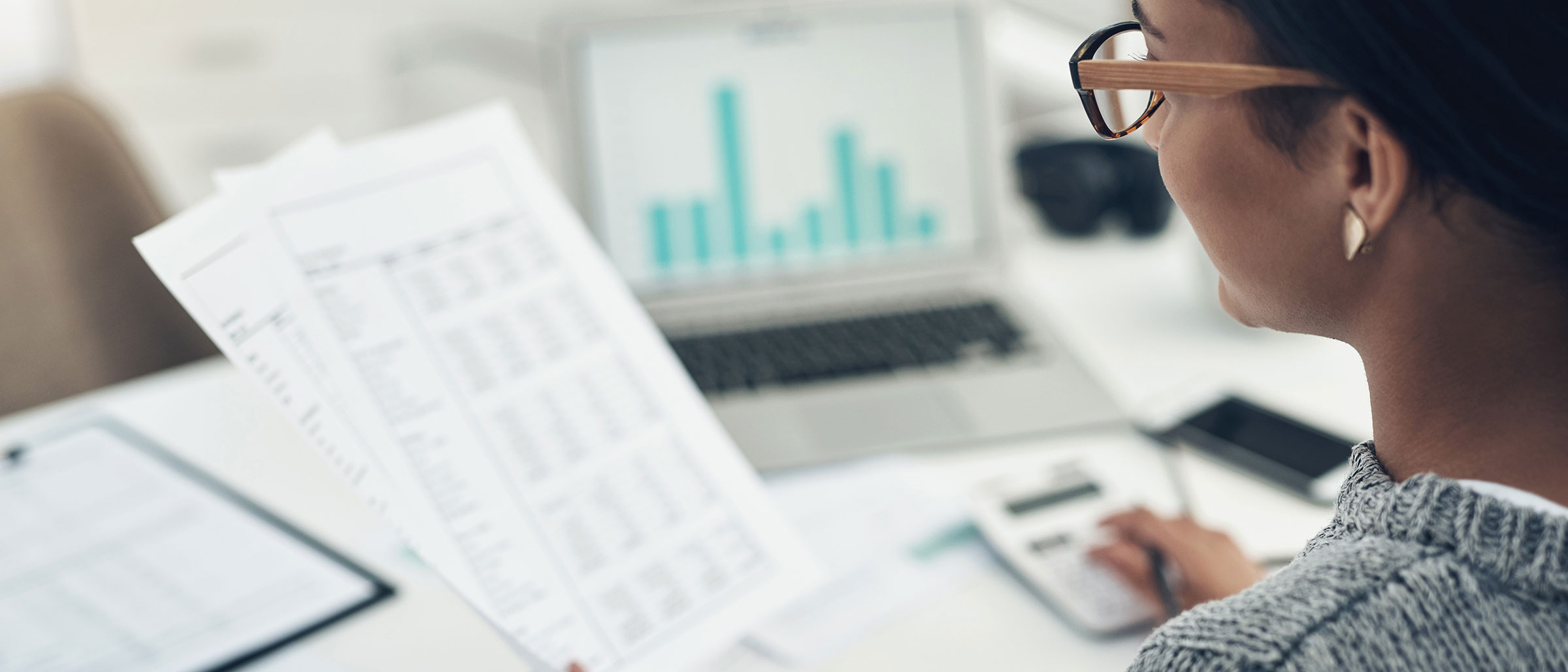 Woman looking at budget spreadsheet