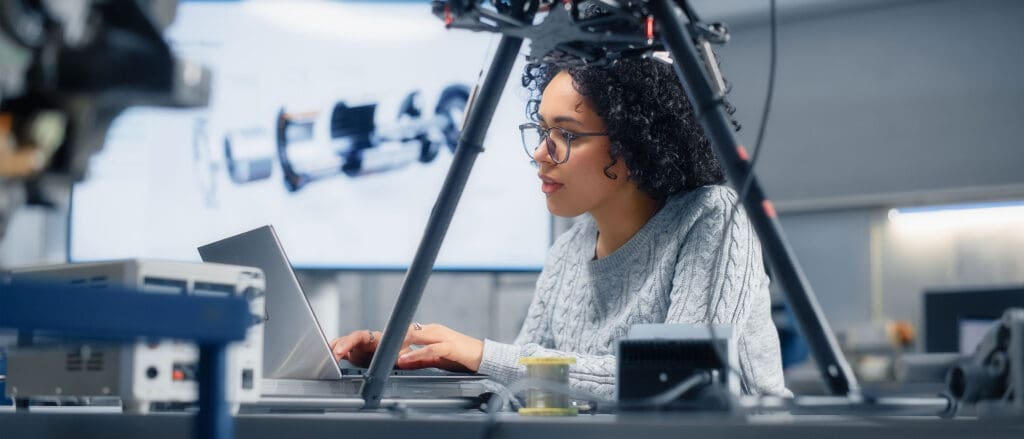 Aerospace & Defense professional typing on laptop