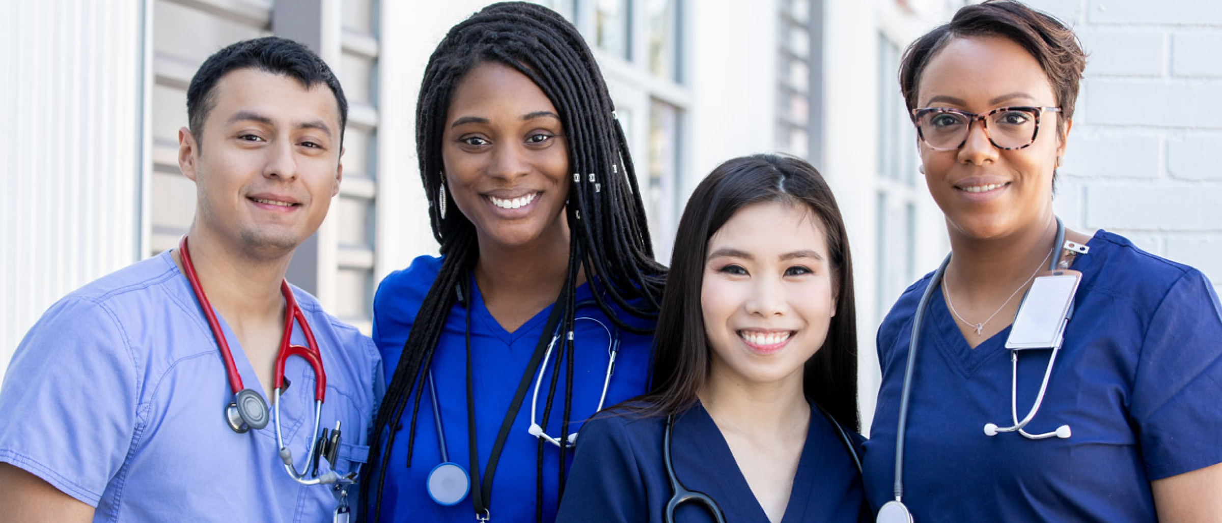 Nurses standing together, smiling