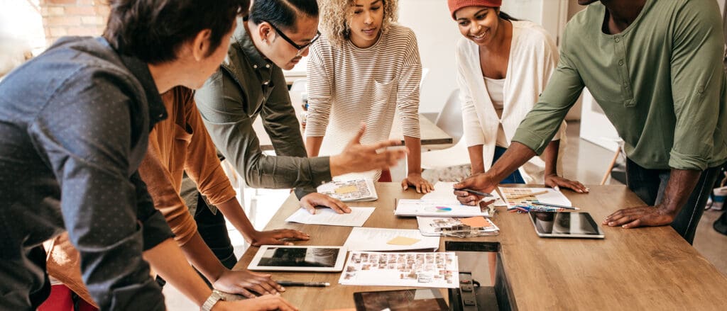 Group of agile transformation professionals collaborating on a project