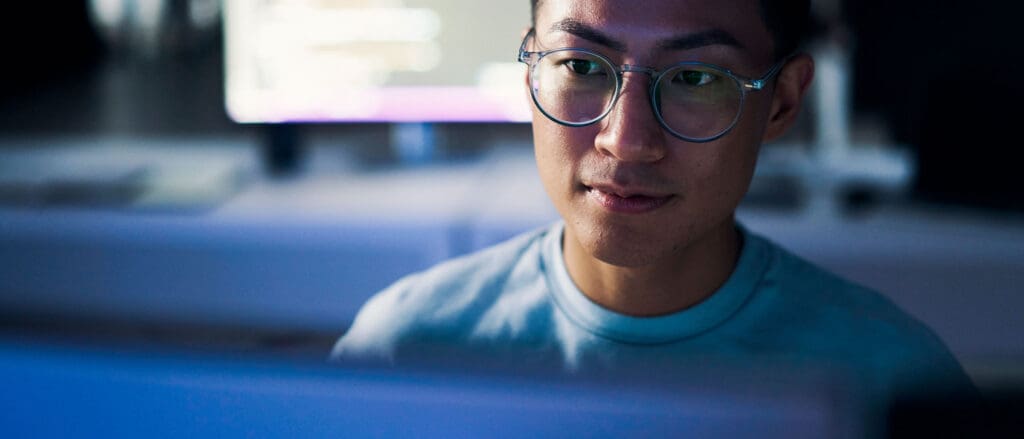 Man wearing glasses working