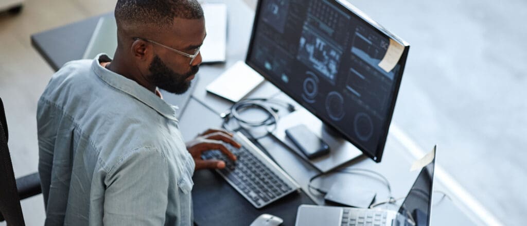 A man working on a computer in an office