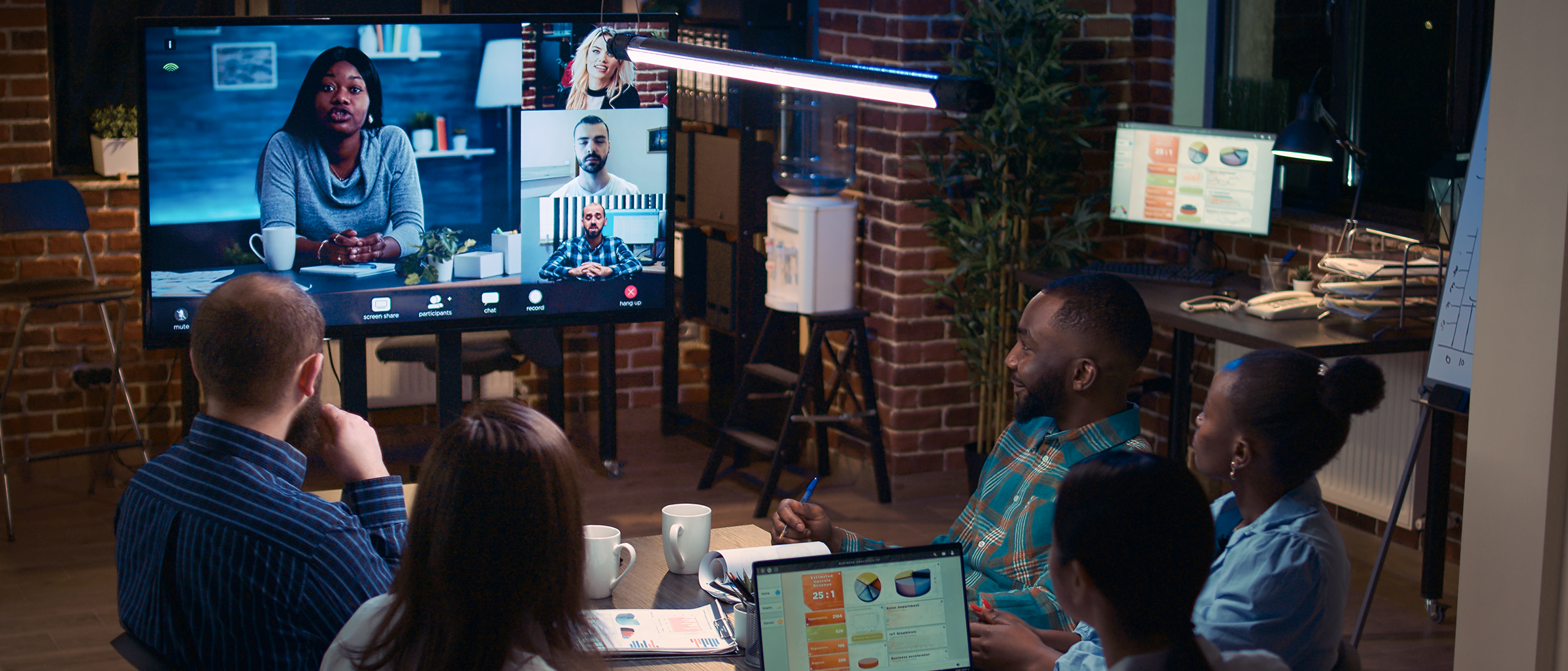 Room of employees attending virtual town hall