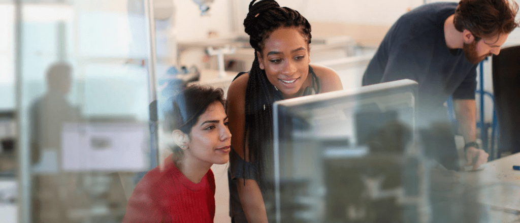 Two Women working on computer