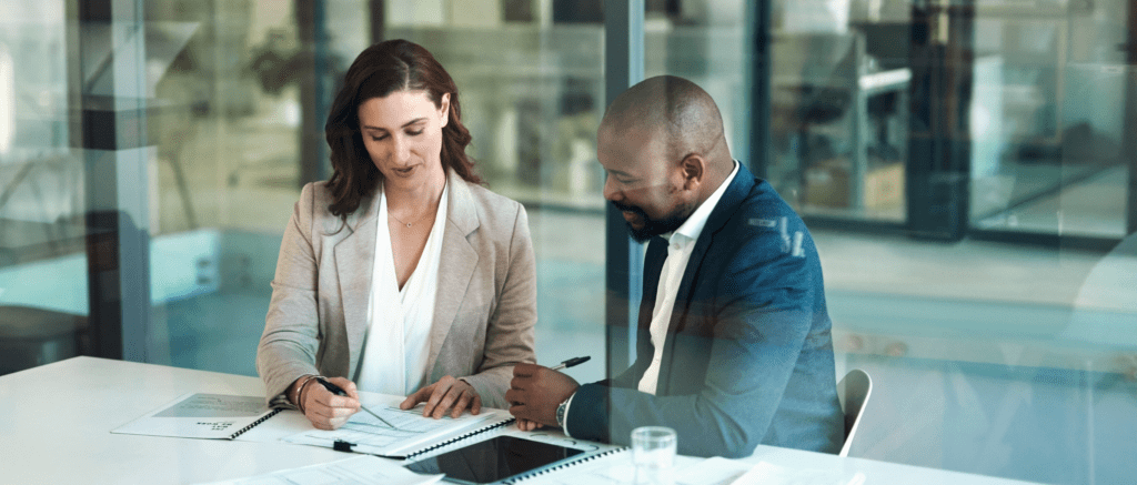 Two people looking at financial documents