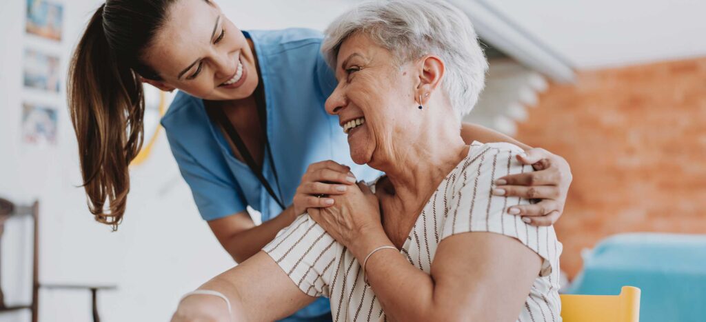 Nurse Working with Elderly Patient at Home