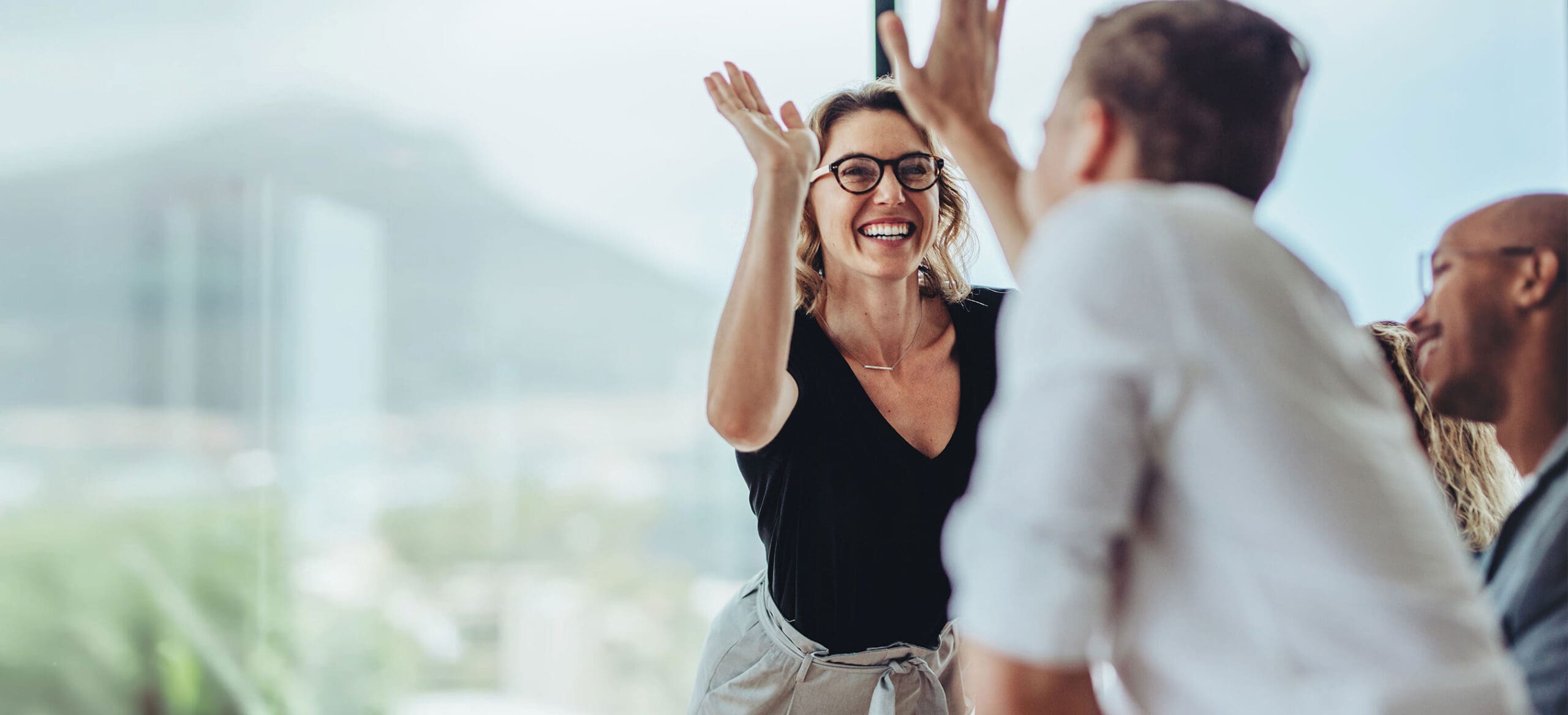 Woman and man high fiving
