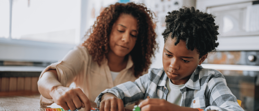 Woman helping child with task