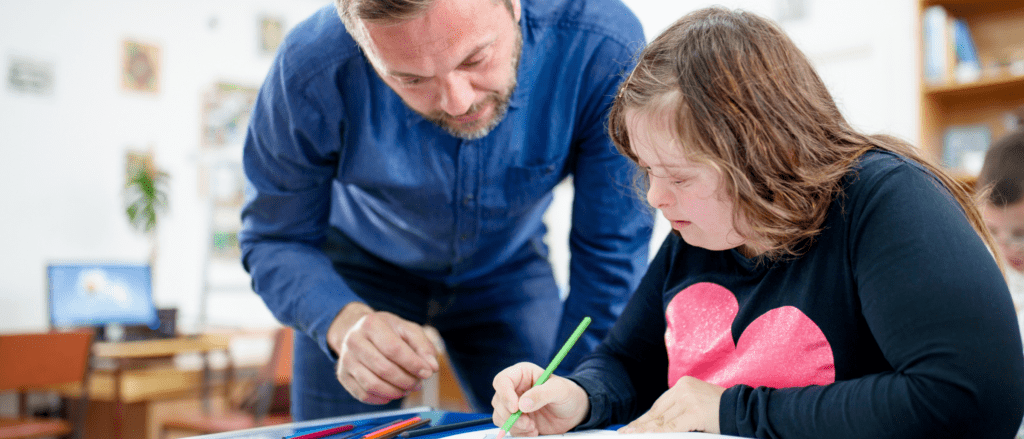 Teacher working with special needs child