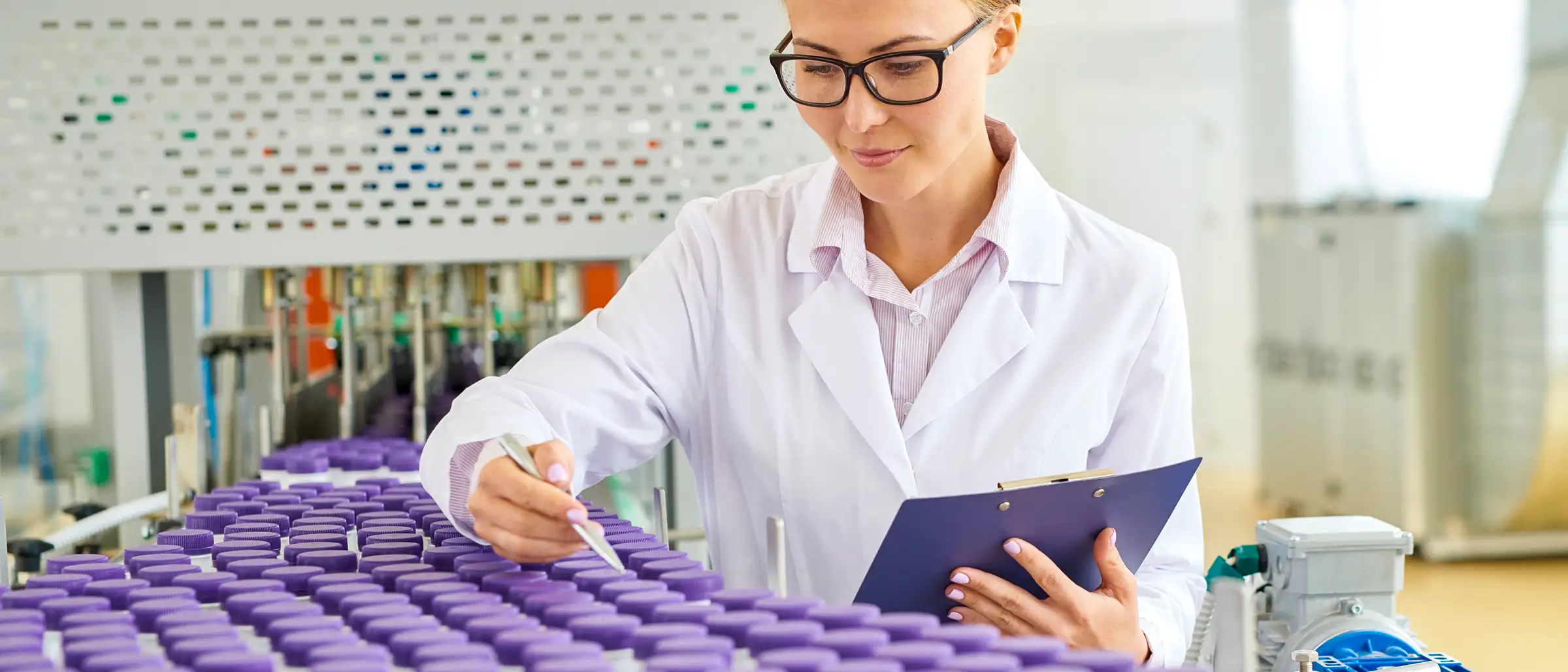 woman working in a lab with test tubes
