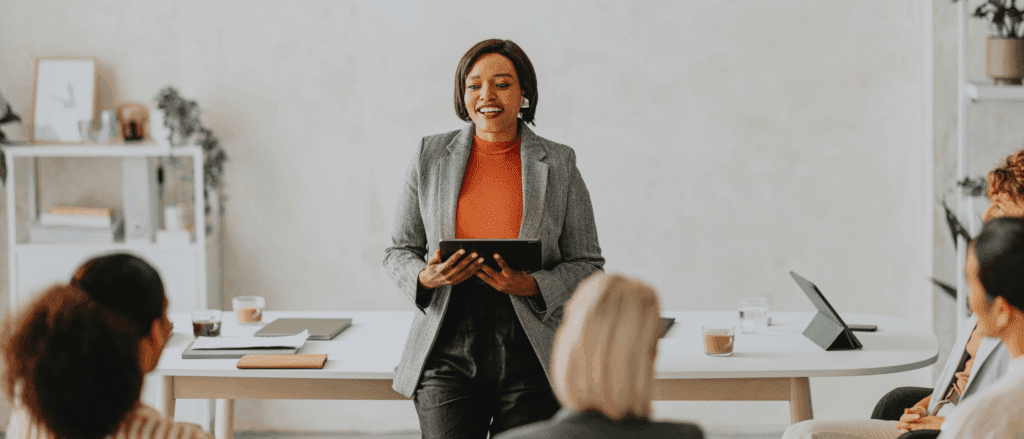 Woman leading a training to a group of professionals