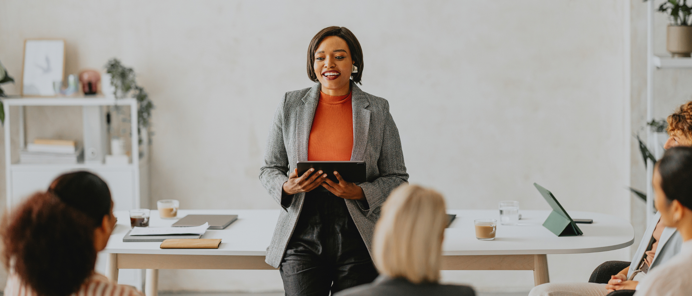 Woman leading a training to a group of professionals