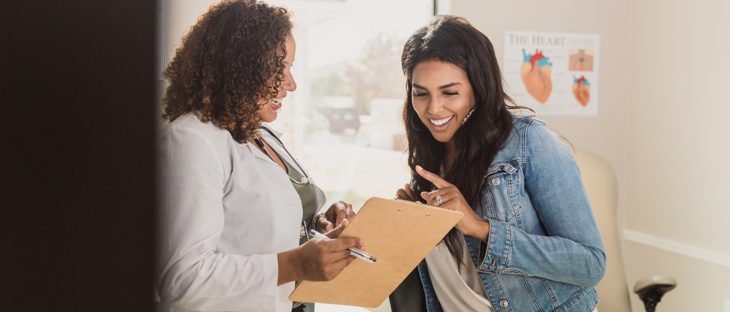 woman speaking with a nurse practitioner in a medical exam room