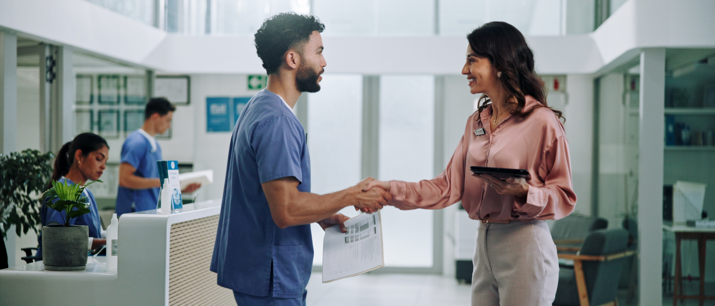 two medical professionals shaking hands