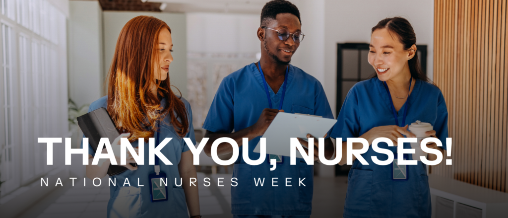 Three nurses walking down a hall