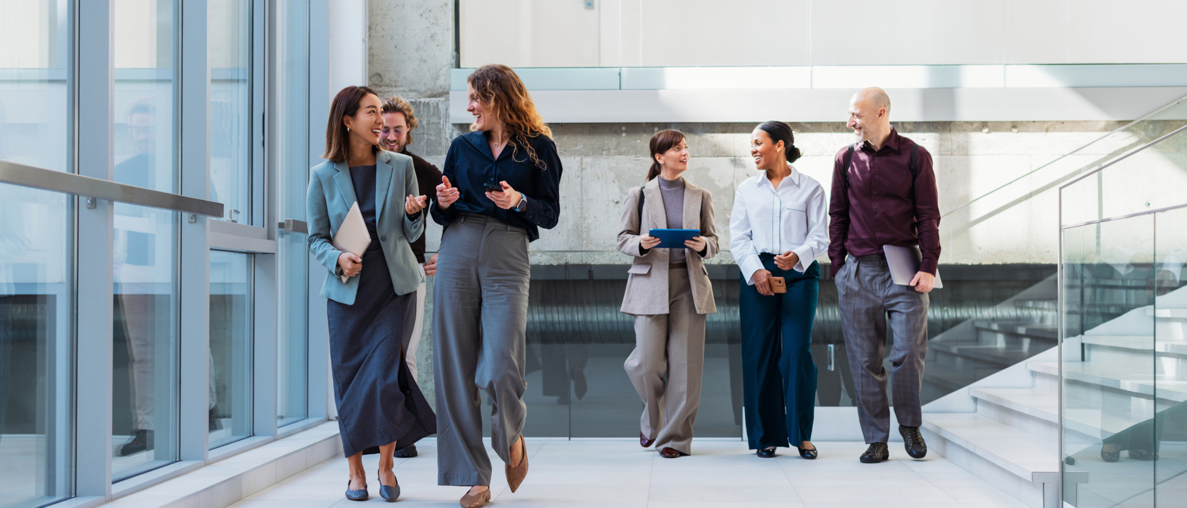 Group of professionals walking in a commercial building