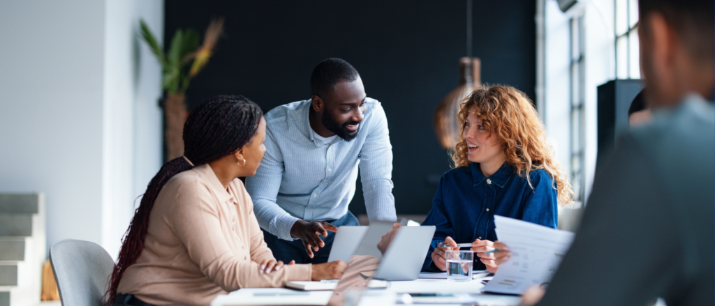 Group of professionals collaborating at a large table