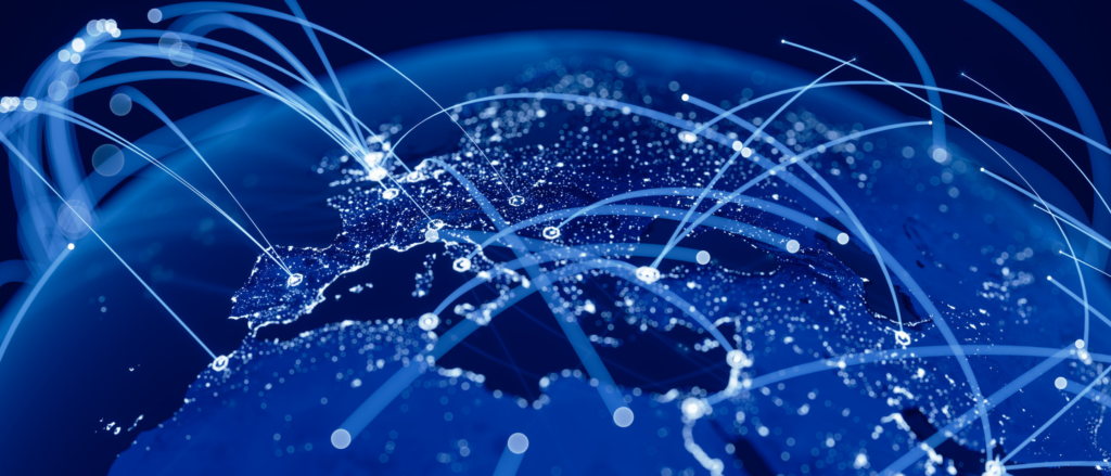 Globe with arching lines connecting various points to simulate data connectivity